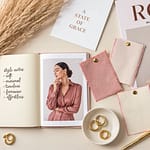 Personal style mood board flatlay with fabric swatches jewelry and notebooks on ivory background
